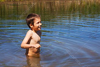 Boy bathing in river