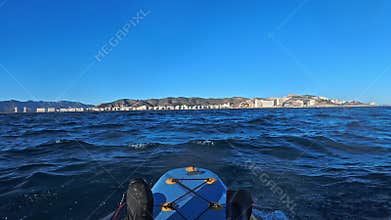 Cullera Skyline in Valencia view from kayak in Mediterranean Sea in blue sky