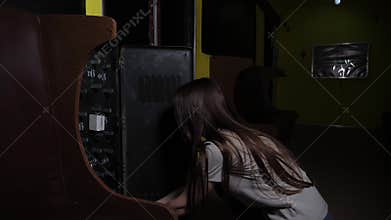 A girl putting tools in a box with instruments,performing a task in a quest room