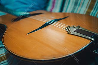 Gypsy jazz acoustic guitar on a colorful blanket
