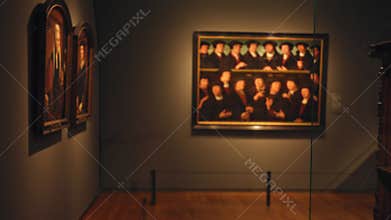 Blurred art gallery interior with defocused historical portraits adorning the museum walls