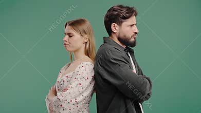 Young Offended Couple After Quarreling, Standing Back. Selfishness, Resentment