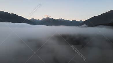 Misty Mountain Majesty: Sunrise Through the Fog