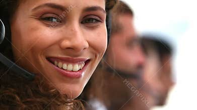 friendly woman smiling on a customer support team