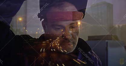 Man lifting padded head-mounted device by city window, adjusting fit for technology calibration