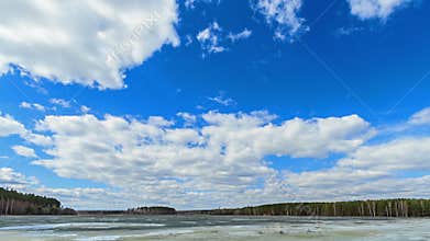 Clouds over the lake. Last snow. Fixed geometry