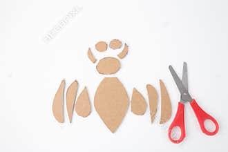 A set of neatly cut cardboard pieces, arranged on a white background, part of a larger craft project. an artistic