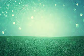 Open field view with defocused lights, or fantasy abstract background with glitter lights, cross process effect