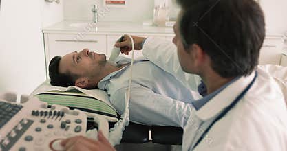 Endocrinologist check patient thyroid gland nodules using ultrasonography equipment