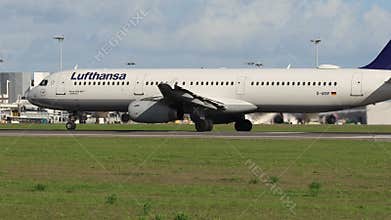 Lufthansa Airbus A321-100 jetliner is taxiing on an airport runway