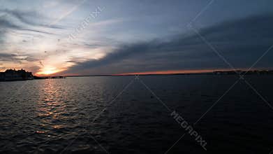 Stunning sunset on calm sea at Barnegat Bay in Mantoloking NJ