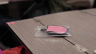 Packed travel blinds for the eyes on a train table. People using blinds for eyes for comfortable travel on a train.