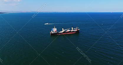 Large anchored specialized ship waiting on burgas harbor refinery black sea Bulgaria areal perspective