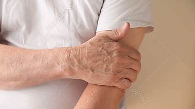 Man with itchy upper arm