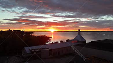 Ascending drone footage of the Tett Centre for Creativity and Learning at sunset in Kingston, Canada
