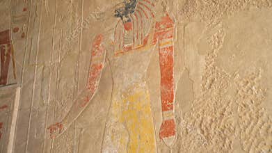 Ancient Egyptian wall paintings of Anubis in the Temple of Hatshepsut