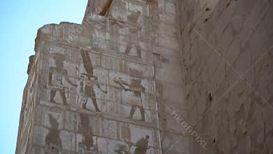 Ancient Egyptian wall with paintings and hieroglyphs in Karnak