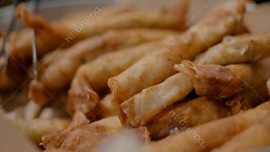 Fried cigars in a large pot