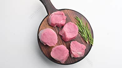 Beautifully cut raw pork medallions for tenderloin meat, waiting to absorb your favorite marinades for a flavorful feast
