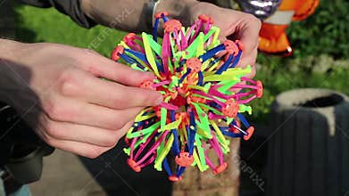 Man with colourful toy