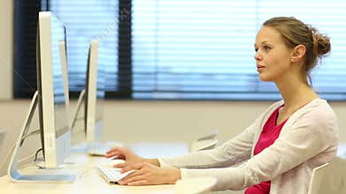 Young female student in a computer classroom