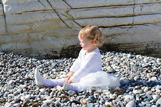 Little girl alone on the beach