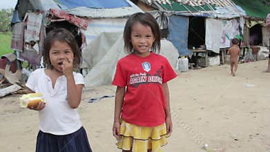 Cambodian kids in slums near phnom penh city dumping area