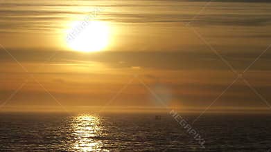 Small Boat on the Ocean During Sunset