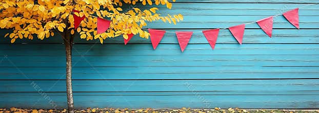 The scene of autumn, complete with bunting and a tree, is ideal for designs and social media with a fall theme