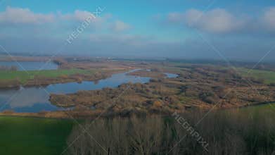 Dutch landscape with rivers and lakes seen from above in sunny spring weather 4k