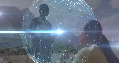 man with backpack standing and woman crouching on hill, featuring tech network sphere overlay