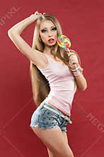Glamourous girl holding lollipop