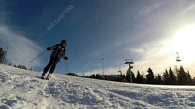 Slow motion of a skier skiing down the slope