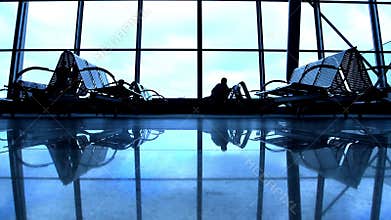 People silhouettes walking at airport