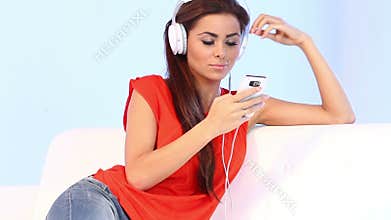 Cute girl on couch listen to the music