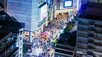 People on the opening space of a shopping mall. Wide Zoom In Shot.