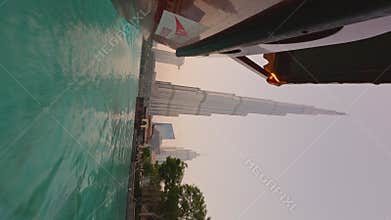 UAE, Dubai, 29 September 2024: A traditional tourist boat abra with tourists on the lake during the famous dancing