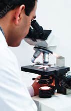 Doctor Using A Microscope