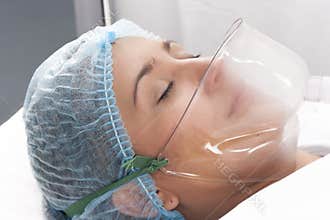 Beautiful patient receives anaesthetic