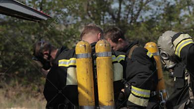 Firefighters wear masks and balloons