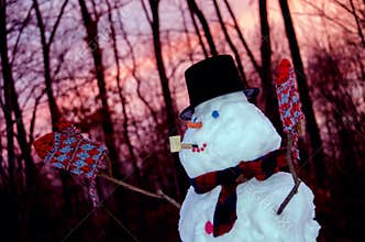 Snowman at sunset