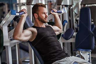 Young man in sport gym club