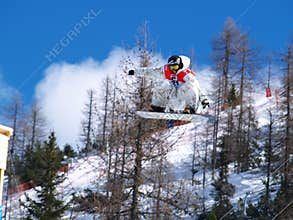 Flying snowboard competitor