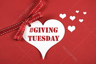 #Giving Tuesday white heart on red background.