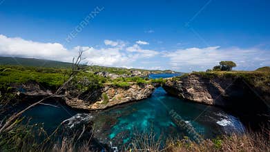 Scenic Limestone Sea Arch Above Crystal Blue Inlet