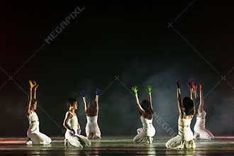 Expressive Dance Ensemble Standing Before Dramatic Stage Smoke