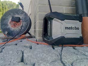 Poland Krakow May 26, 2026 11:46 AM. Metabo - \"armored\" construction site radio receiver on the construction site