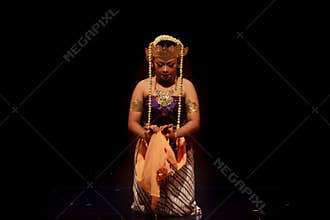 Close Portrait of Traditional Performer Holding Ceremonial Cloth