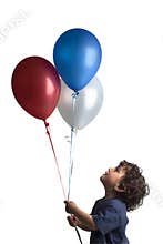 Little boy red blue and white balloons