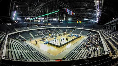 Time lapse of a sport arena seats filling up with crowd of people